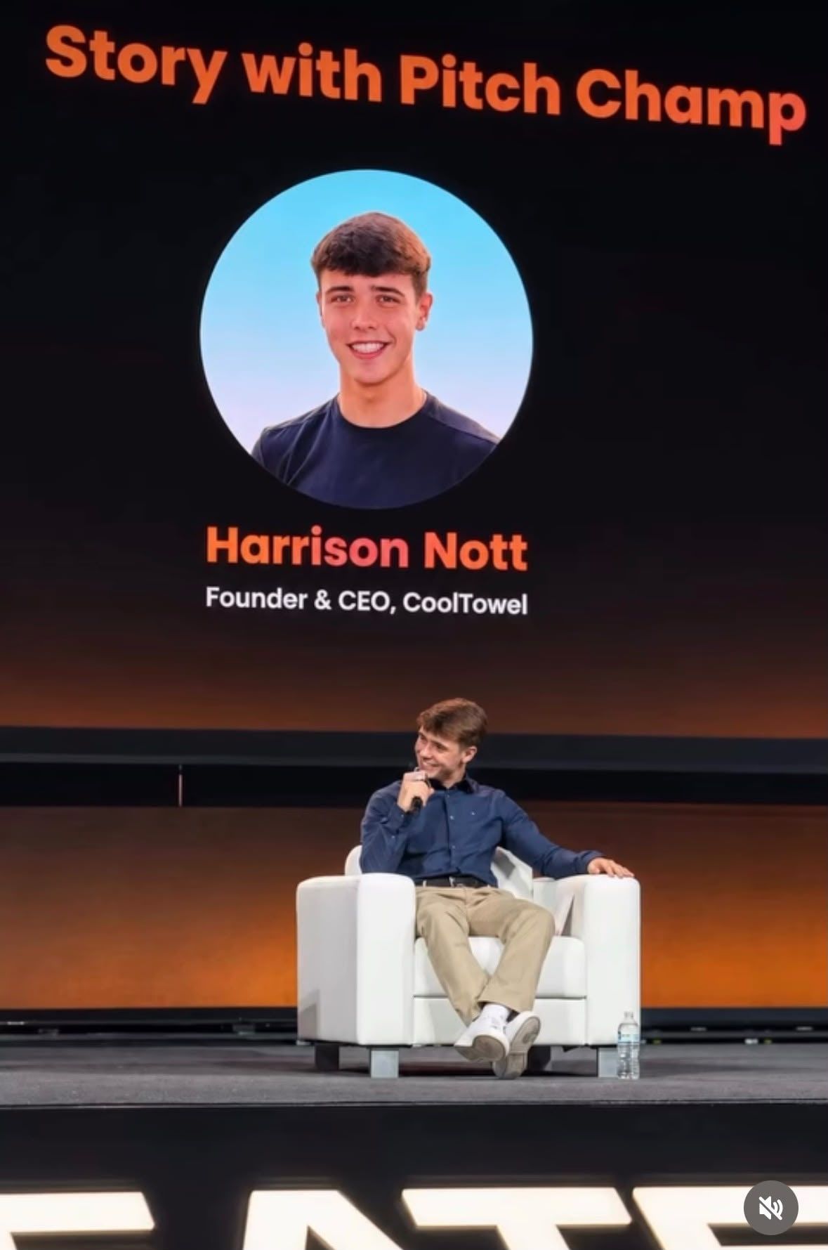 Harrison Nott alone on the CoCreate main stage, his name and title on the screen behind him